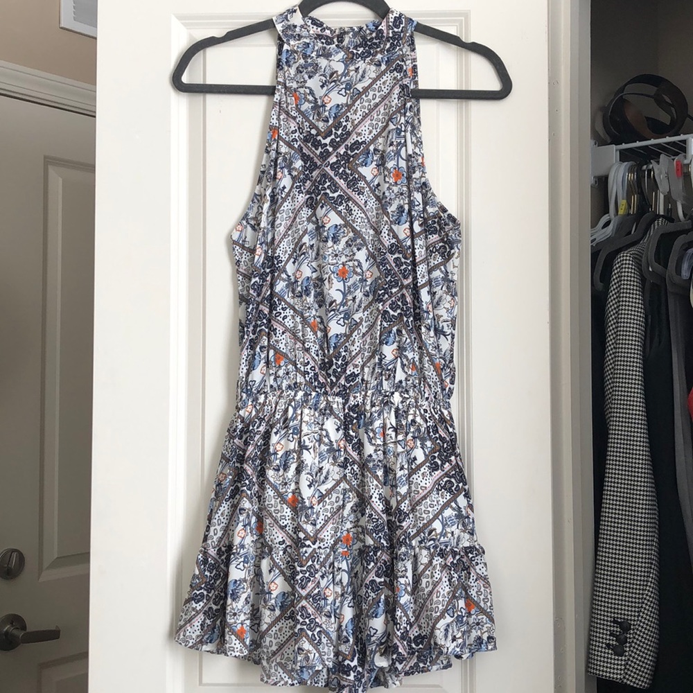 A cute flirty ruffled romper with blue and orange!